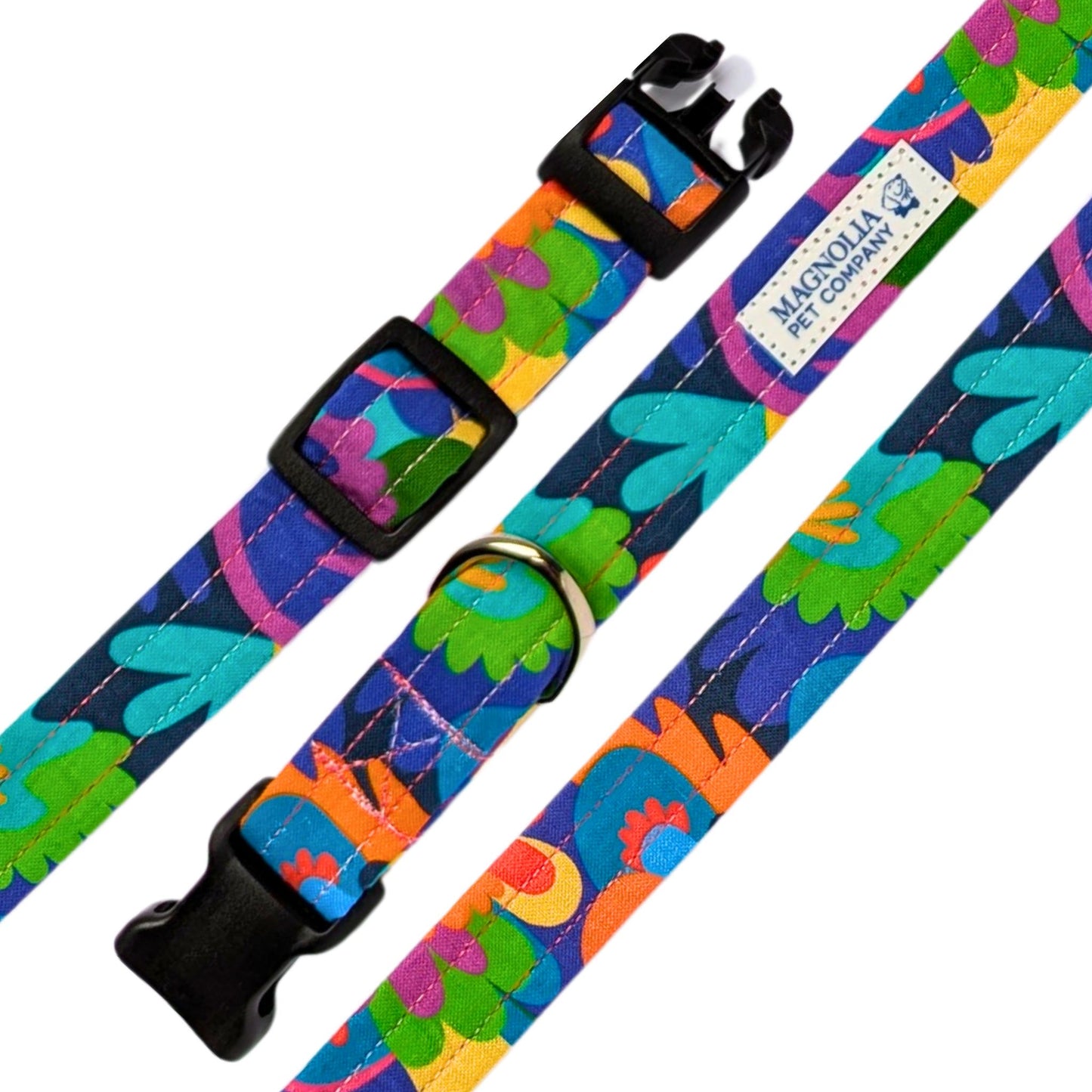 This cheerful and modern print features a bold palette of purples, aquas, blues, reds, greens, and yellows on a navy background.