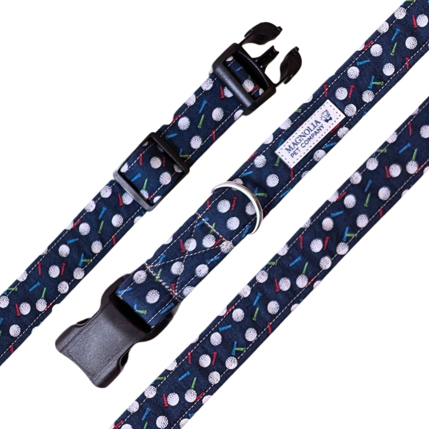 navy fabric, it features a playful design of light blue and red tees with golf balls