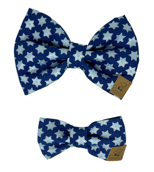 Dog bow tie featuring a dark blue background adorned with a glittery Star of David