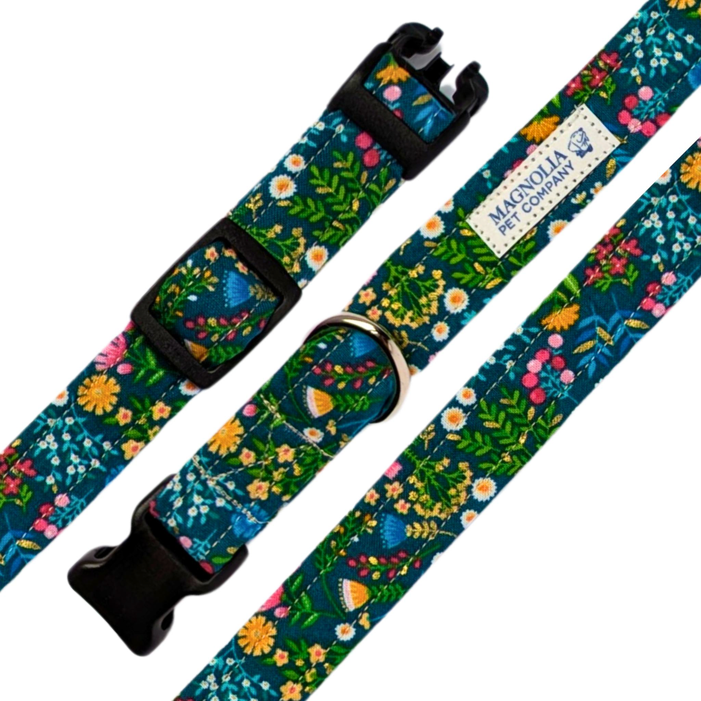 his bright blue collar is adorned with small, colorful flowers in pink, yellow, and white, adding a touch of playful charm