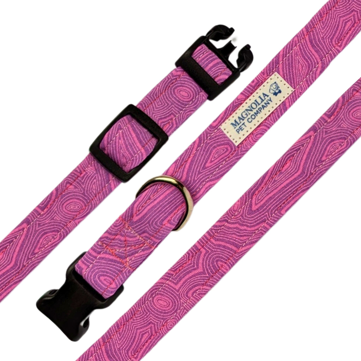 This purple collar features small, delicate pink patterns, adding a touch of subtle elegance