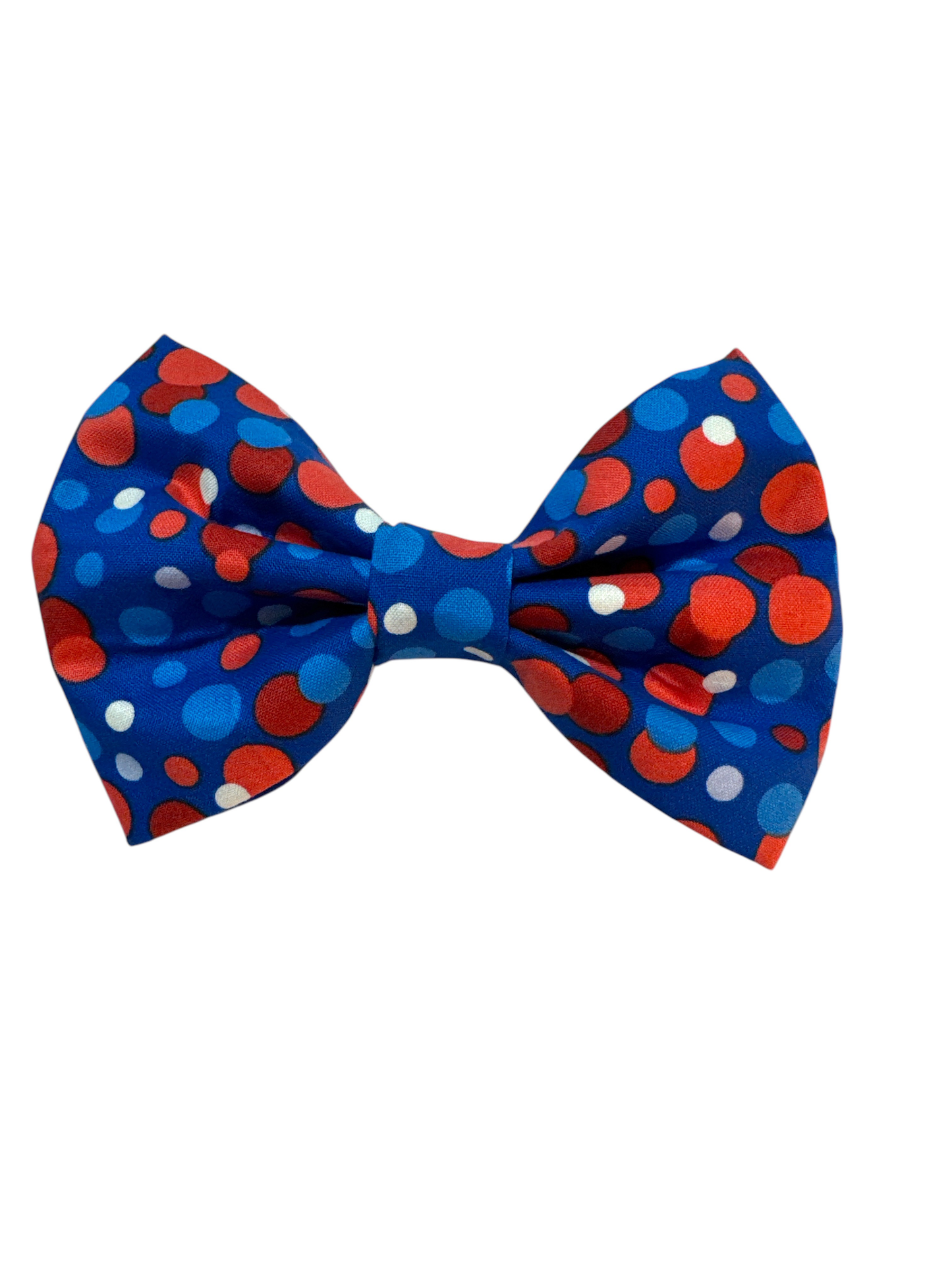 Featuring large red, white, and blue polka dots on a vibrant blue background