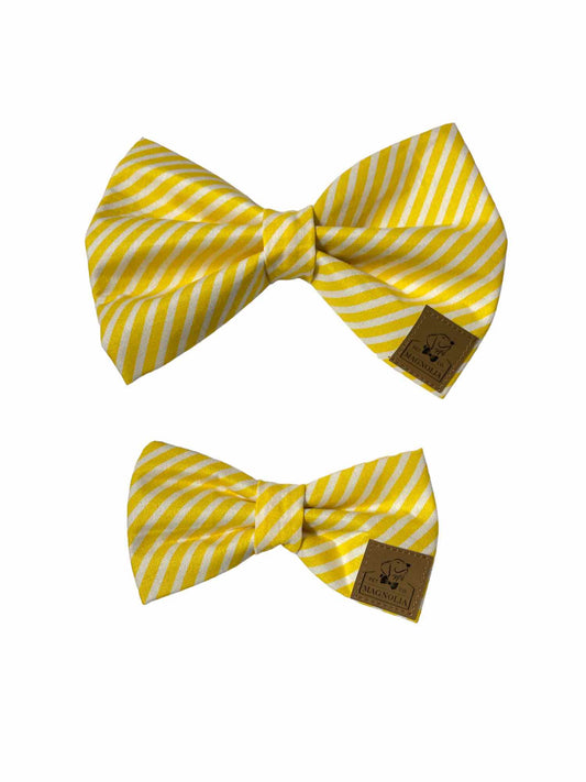 This charming accessory features a classic pattern of yellow and white stripes, offering a timeless yet cheerful design that brightens up any occasion