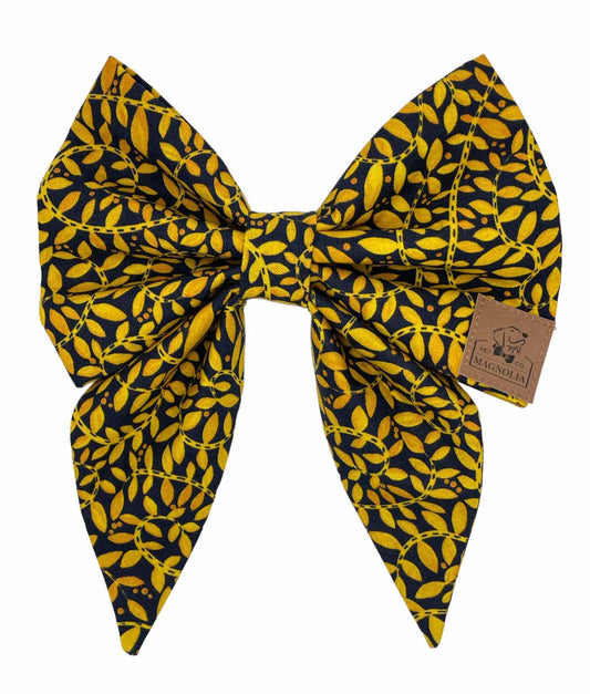 Upgrade your pup's game day wardrobe with this elegant and stylish bow featuring a classic black and gold floral print design. Handmade in the USA.