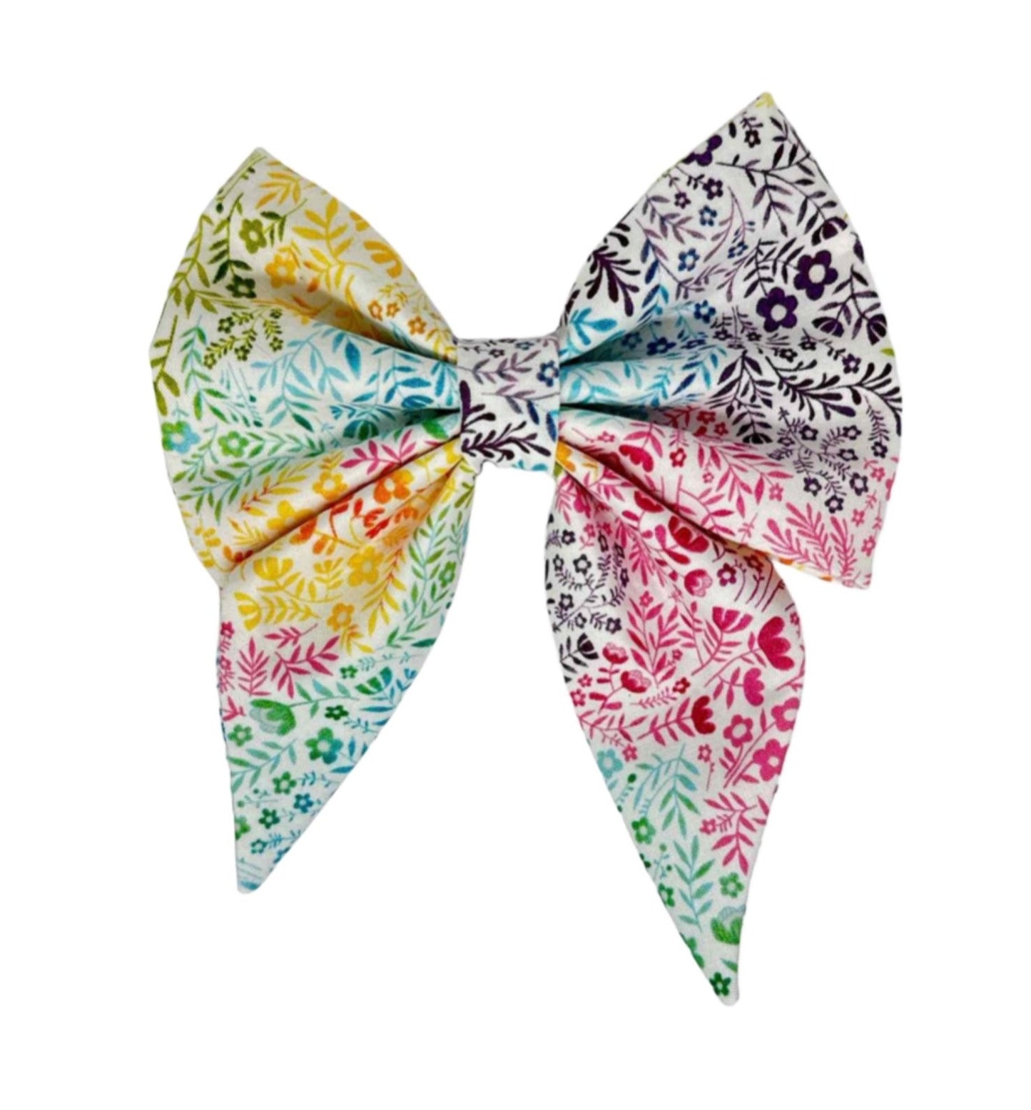This vibrant yet serene dog bow showcases a contemporary garden print with shades of blue, pink, purple, and yellow against a white backdrop. Handmade USA