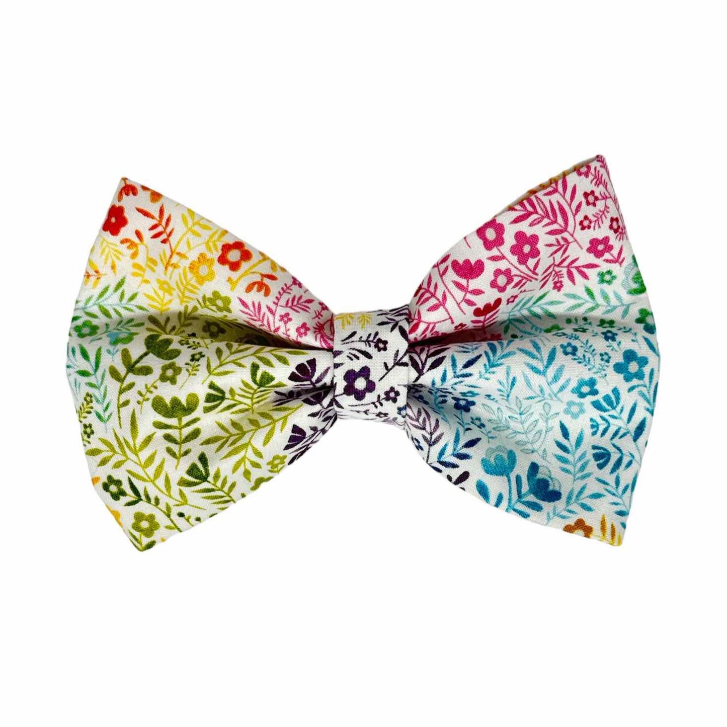 This serene dog bow tie showcases a contemporary garden print with shades of blue, pink, purple, and yellow against a white backdrop. Handmade in the USA.