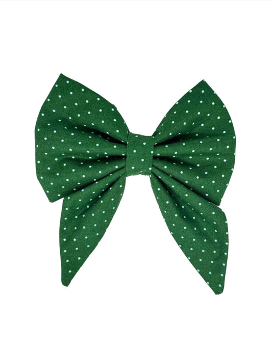 dark forest green, sprinkled with small light blue polka dots