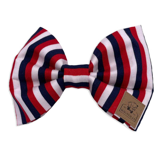 Dog Bow Tie featuring Red, White, and Blue Striped Dog Bow Tie by Magnolia Pet Company .