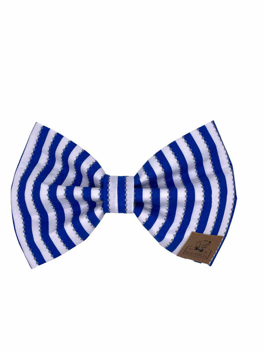 Featuring striking sapphire blue stripes on a crisp white background, this bow is perfect for cheering on your favorite team in style