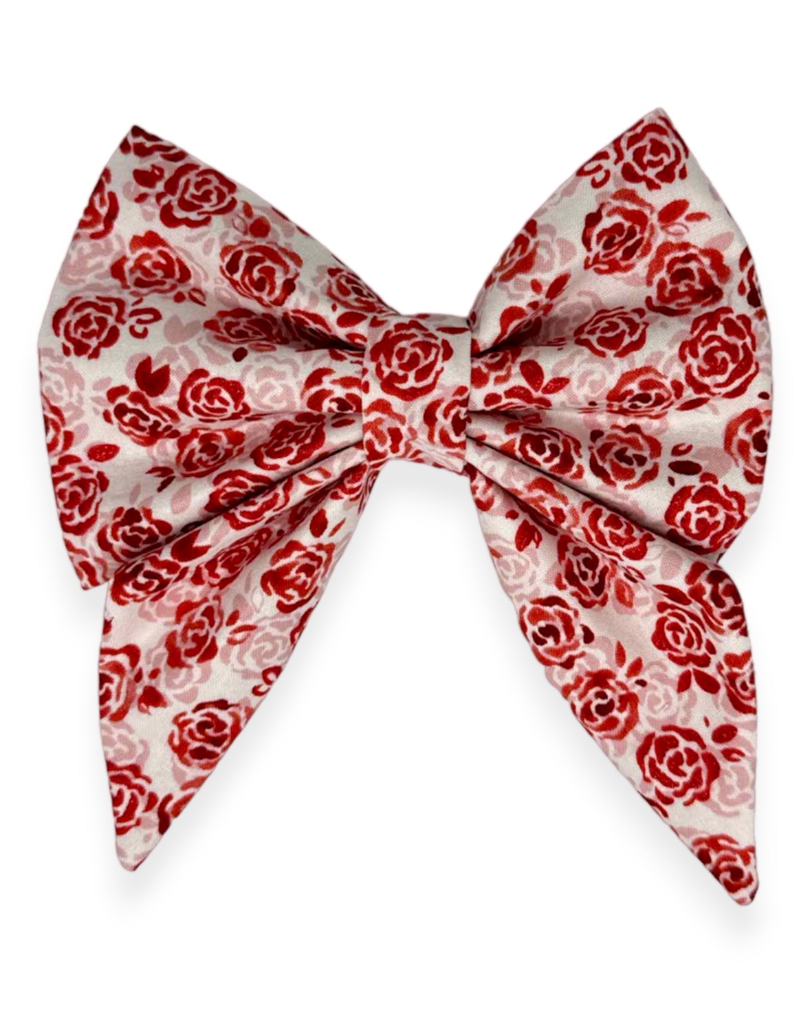 This dazzling dog bow features red and pink roses with a dash of sparkle set against a cream white background.  Handmade in the USA.