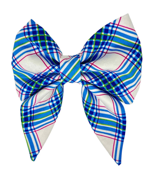 Dog bow featuring a classic blue tartan plaid accented with vibrant hot pink highlights, this bow seamlessly blends tradition with a modern twist.