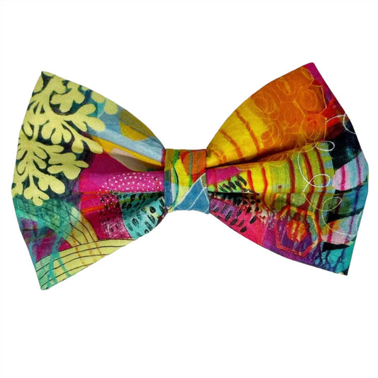 This unique accessory is a dazzling kaleidoscope of pinks, reds, blues, yellows, and greens, designed to make your furry friend stand out in any crowd. Each bow features a one-of-a-kind swirl pattern, ensuring that no two bows are ever alike, making your pet's accessory as unique as they are
