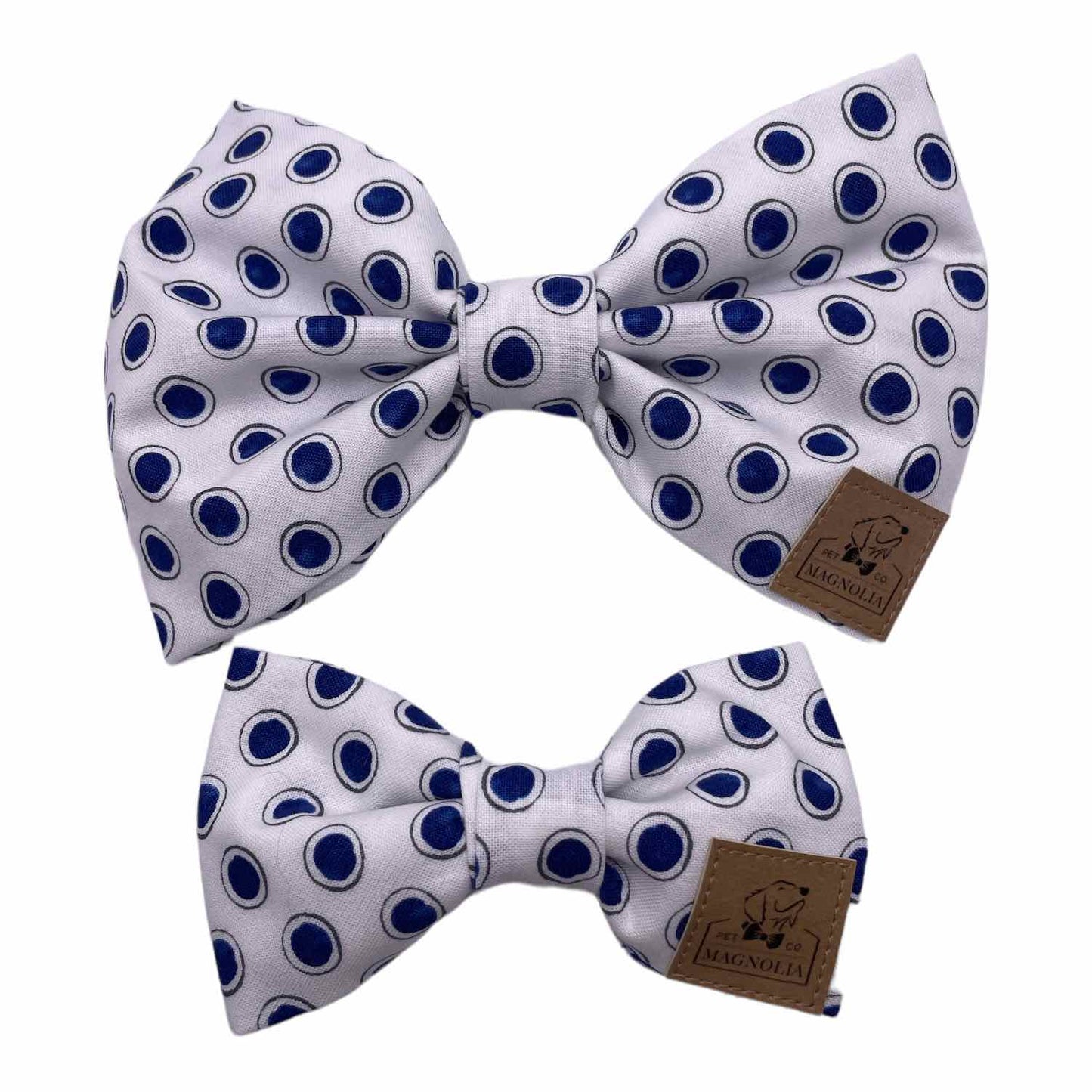 Our playful yet sophisticated Blue Dot Dog Bow features a vibrant navy dot pattern against a crisp white background. Handmade in the USA.
