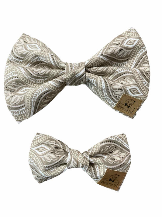 Featuring a light mocha latte hues and a stunning flame damask pattern, this dog bow tie adds a touch of luxury to your furry friend's ensemble. Whether it's a formal occasion or simply a day out on the town, this bow tie ensures your pup stands out with dressy sophistication.