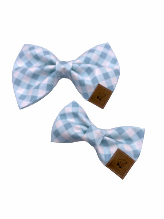 This delightful accessory features a timeless light blue gingham check pattern