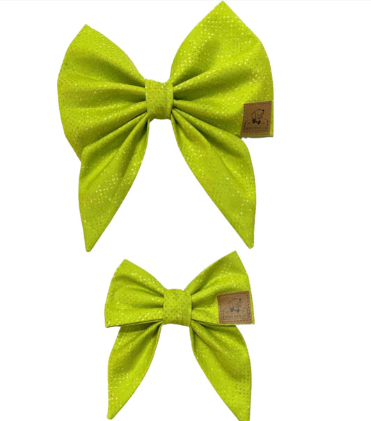 This trendy accessory features a vibrant lime green fabric sprinkled with tiny digitized specs