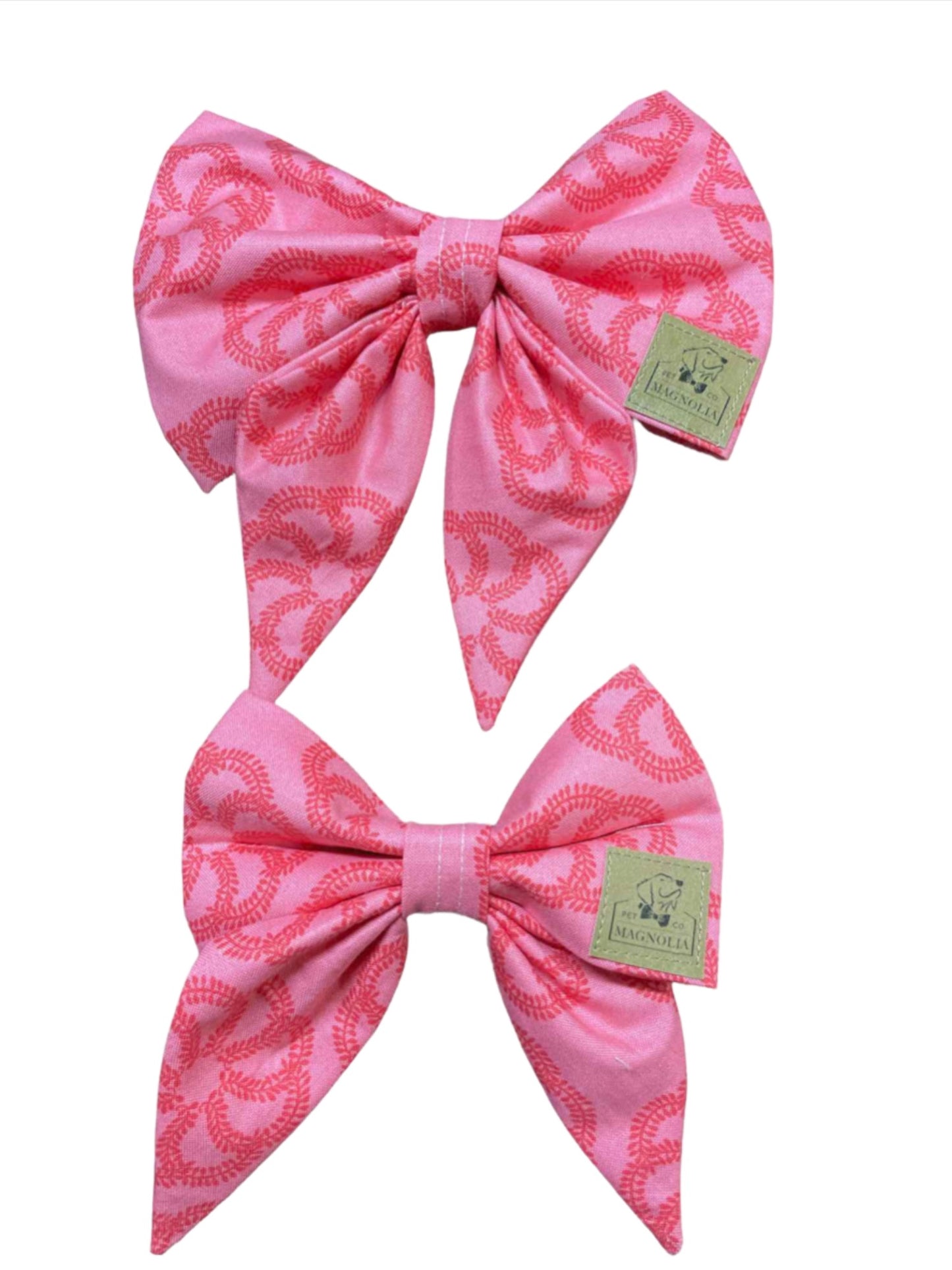 This beautiful accessory features a vibrant floral design set against a soft pink fabric background, creating a look that's both elegant and eye-catching