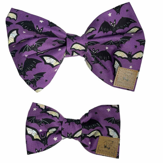 Our Plum Batty dog bow tie features black and white bats on a dark purple background. Glow in the Dark.