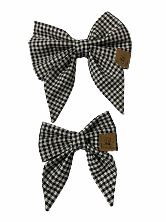 Upgrade your pup's style today with our Black and White check Gingham Bow Tie. This classic pattern is perfect for all occasions. Handmade in the USA