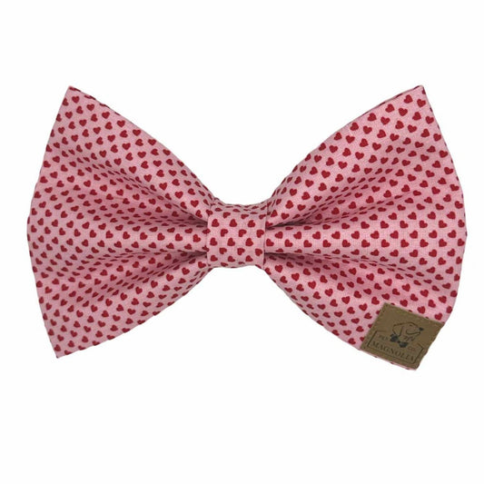 Dog Bow featuring soft pink fabric sprinkled with tiny red hearts creates an irresistibly sweet and stylish look.