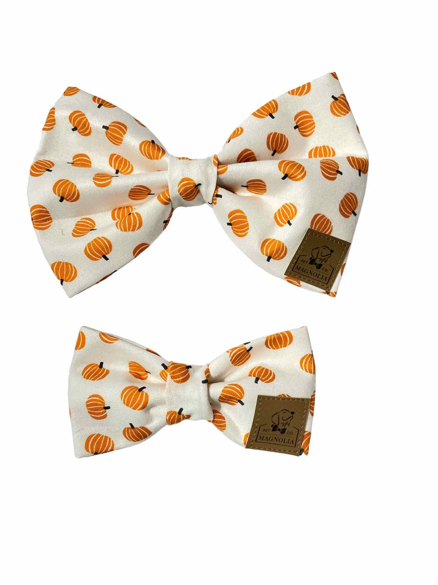 crafted with a crisp white background, providing a clean and elegant canvas for the vibrant design. Scattered across the fabric are small, cheerful orange pumpkins