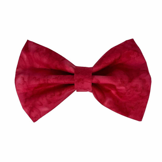 Elevate your furry friend's style with our Red Wine Cabernet Batik Dog Bow Tie, the perfect accessory for both park strolls and dining in style. Meticulously crafted with attention to detail and quality, this bow tie effortlessly blends style and comfort for your canine companion.  Featuring a rich Cabernet hue and intricate batik-inspired patterns, this bow tie exudes sophistication and worldly charm. 