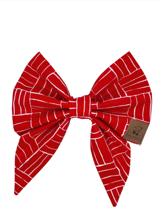 eatures a vibrant cardinal red hue, accented with blocks of alternating thin white lines