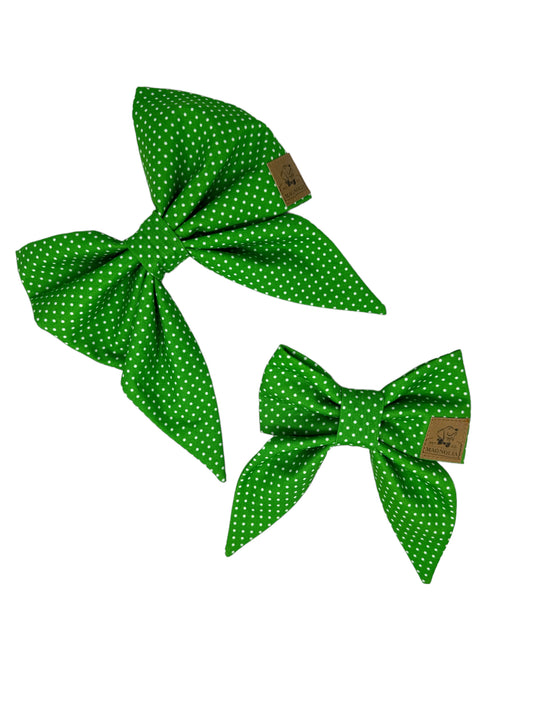 Featuring a fresh green background sprinkled with petite white polka dots