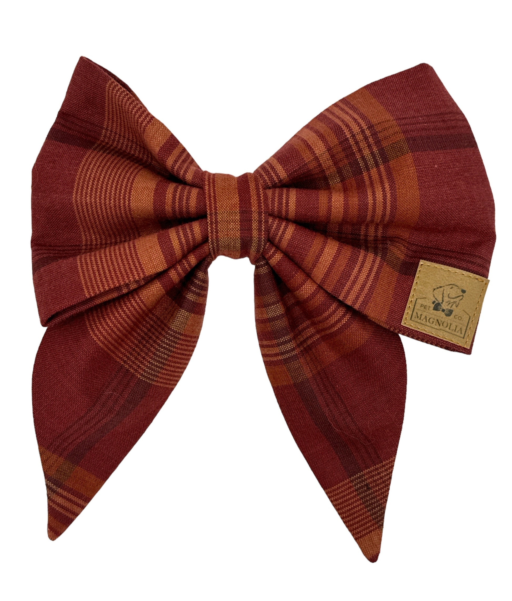 Dog bow featuring a rich maroon background adorned with a muted beige plaid pattern