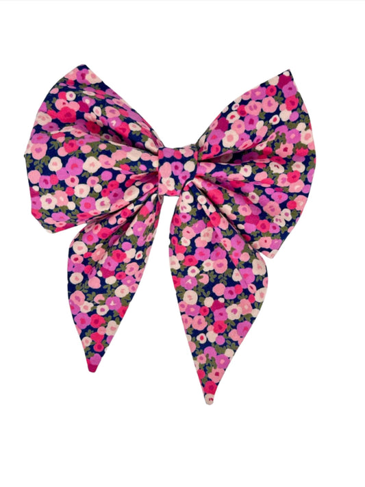 featuring a dark charcoal background adorned with vibrant groupings of pink, blush, and purple posies