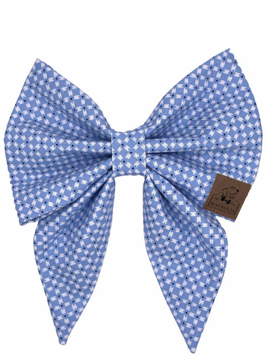 crafted in a soothing light blue fabric adorned with a delicate white crisscross pattern.