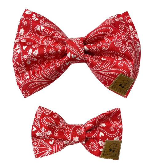 Our Sweetheart Paisley dog bow features a white paisley design set agains a red background adorned with delicate white hearts.  Handmade in the USA.