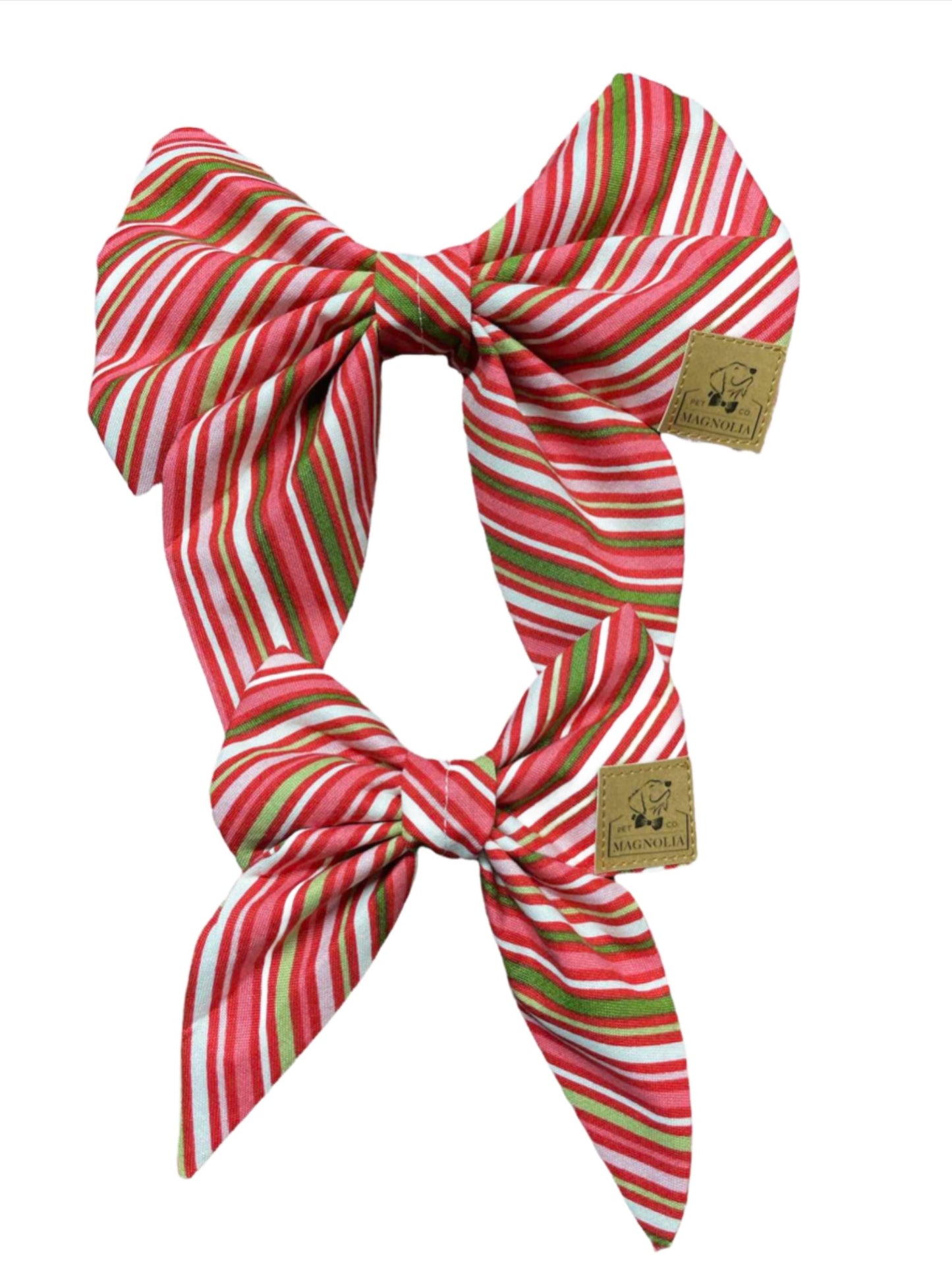 Dog bow featuring a playful diagonal pink, red, and green stripes, it's a burst of vibrant joy perfect for any pup's collar by Magnolia Pet Company.
